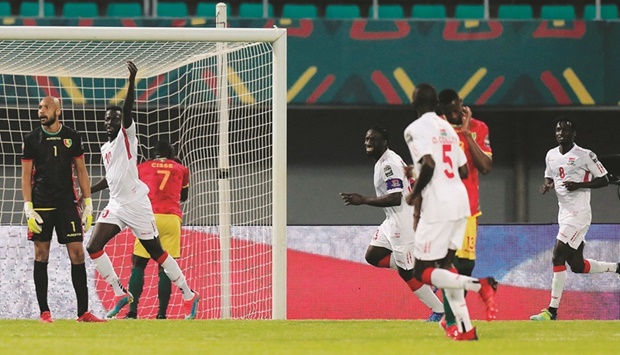 Gambiau2019s Musa Barrow (second from left) celebrates scoring against Guinea during the Africa Cup of Nations match at the Stade de Kouekong in Bafoussam, Cameroon, yesterday. (Reuters)