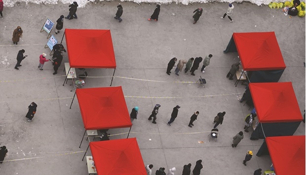 People line up for nucleic acid test at a makeshift testing site at a residential compound, following new confirmed cases of the Covid-19 in Beijing.