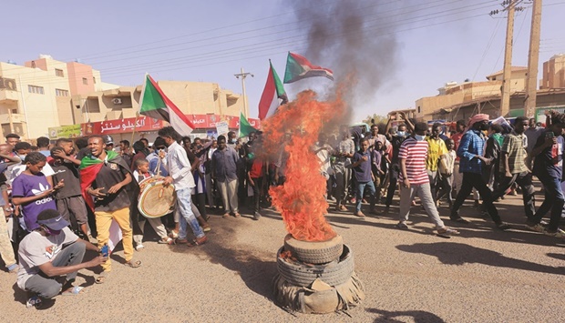 Protesters march during a rally against military rule following last monthu2019s coup in Khartoum, yesterday.