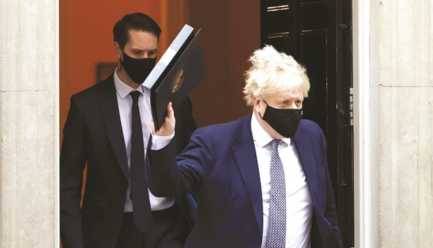 British Prime Minister Boris Johnson walks outside Downing Street in London on Tuesday.