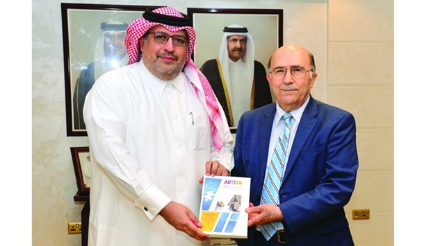 Gulf Times Editor-in-Chief Faisal Abdulhameed al-Mudahka receives a copy of 'Autism Spectrum Disorder (ASD): A puzzle that continue to baffle scientists, researchers and physicians' from Dr Fouad Alshaban