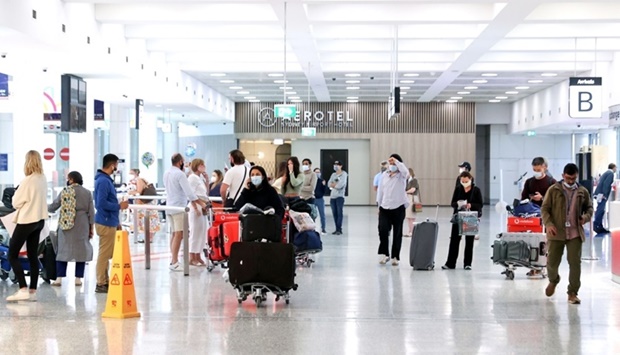 Passengers walk through the international arrivals terminal of Sydney Airport. Travel restrictions around the world on account of Covid-19 seems to have had little impact on the spread of pandemic, including the Omicron variant, reveals a new study.