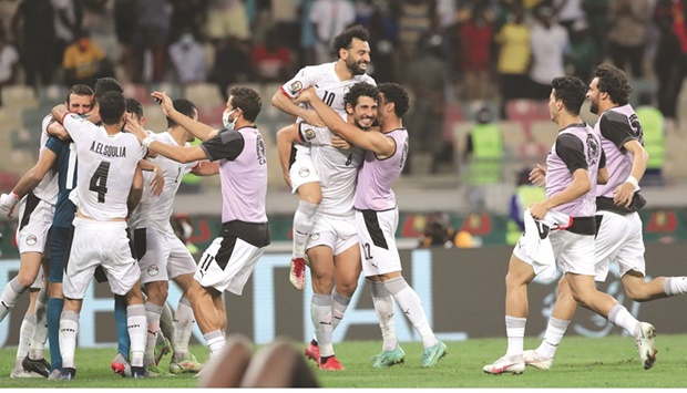 Egyptu2019s forward Mohamed Salah celebrates with teammates after winning the Africa Cup of Nations round of 16 match against Ivory Coast at the Stade de Japoma in Douala yesterday. (Reuters)