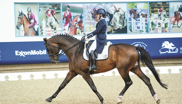 Jessica Waldon astride 14-year-old stallion San Francisco performs during the Longines Hathab Dressage Tour at the Qatar Equestrian Federationu2019s indoor arena on Thursday.