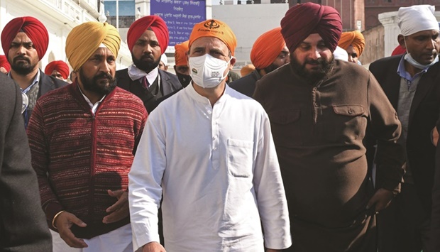 Indiau2019s opposition Congress party leader Rahul Gandhi (centre) walks during his visit to the Golden Temple ahead of state assembly elections in Amritsar yesterday.