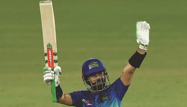 Multan Sultansu2019 captain Mohamed Rizwan celebrates after scoring a half century during the Pakistan Super League match against Karachi Kings at the National Cricket Stadium in Karachi yesterday. (AFP)