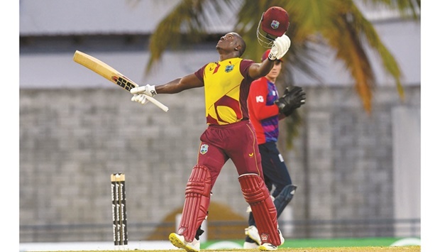 Rovman Powell of West Indies celebrates his century during the 3rd T20I against England at Kensington Oval in  Bridgetown, Barbados. (AFP)