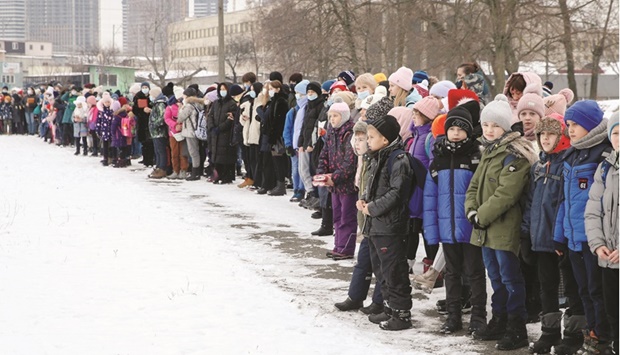 Teachers and schoolchildren line up after an evacuation from the building of a  local school in Kyiv during bomb threat and emergency training, which was  organised yesterday by Ukraineu2019s State Emergency Service and police.