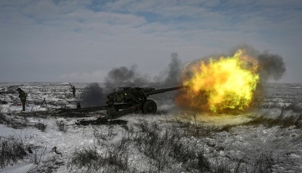 A Russian army service member fires a howitzer during drills at the Kuzminsky range in the southern Rostov region, Russia January 26, 2022. REUTERS