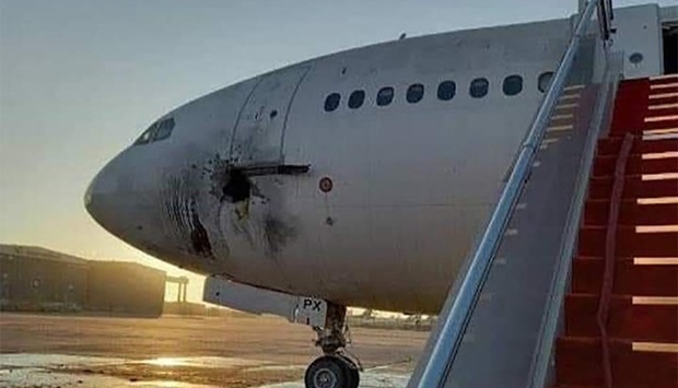 The damaged stationary aircraft on the tarmac of Baghdad airport, after rockets reportedly tragetted the runway. PHOTO: Facebook Page of the Iraqi Ministry of Transportation/AFP
