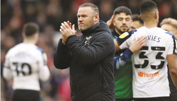 Derby manager Wayne Rooney applauds the fans after the match against Nottingham Forest in this January 22, 2022 photo. (Reuters)