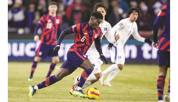 US midfielder Yunus Musah (6) dribbles the ball during a CONCACAF 2022 FIFA World Cup qualifier against the El Salvador at Lower.com Field in Columbus, Ohio. (AFP)