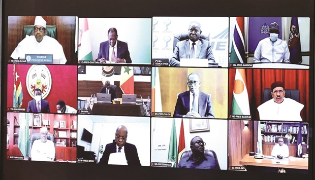 Leaders of the Economic Community of West African States (Ecowas) are pictured on a screen during a virtual summit on Burkina Faso and Mali, in Abidjan, Ivory Coast, yesterday.
