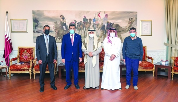 Ali bin Hassan al-Hammadi and Rajeh Hussein Badi with other officials.