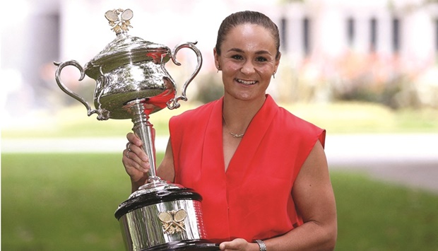 Ashleigh Barty poses with the Australian Open trophy at the Royal Exhibition Building in Melbourne yesterday. (Reuters)