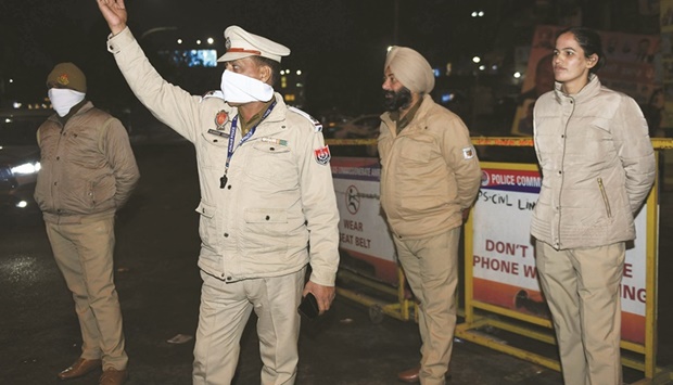 Police personnel stand guard during a night curfew to curb the spread of the Covid-19 coronavirus in Amritsar yesterday.