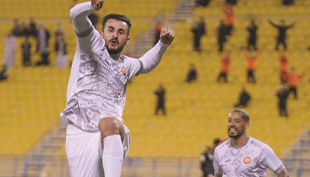     Umm Salalu2019s Aymen Hussein celebrates after scoring against Al Rayyan during the QNB Stars League match at Thani bin Jassim Stadium yesterday. PICTURE: Ram Chand