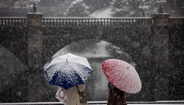 Snow falls near the Imperial Palace in Tokyo on January 6, 2022