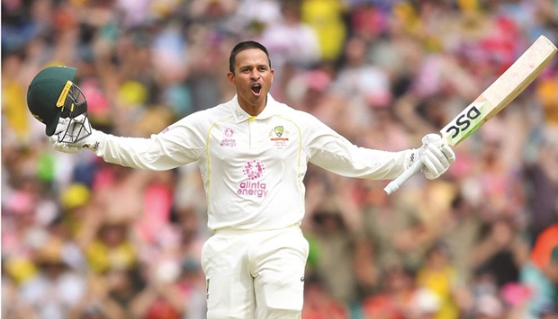 Australiau2019s Usman Khawaja celebrates after scoring a hundred during the fourth Ashes Test against England in Sydney. (Reuters)