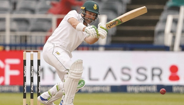 South Africau2019s Dean Elgar plays a shot during the fourth day of the second Test against India in Johannesburg yesterday. (AFP)