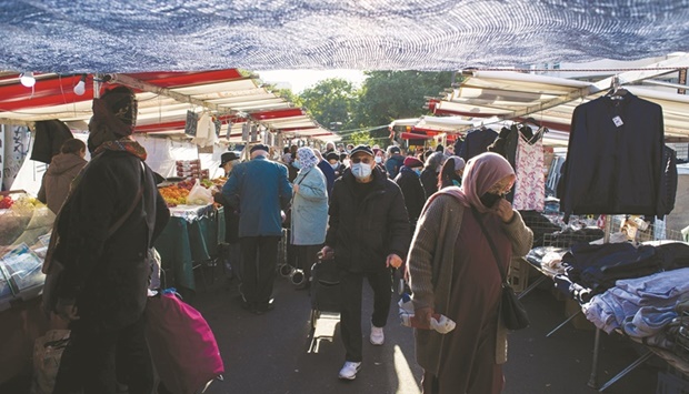 Shoppers browse stalls at the Belleville market in Paris. Inflation in the euro region accelerated beyond already record levels, defying expectations for a slowdown and complicating the task for European Central Bank officials who insist the current spike is temporary.