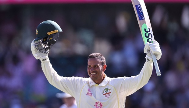 Australia's Usman Khawaja celebrates reaching his century (100 runs) on day four of the fourth Ashes cricket test between Australia and England.