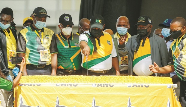 South Africau2019s President and African National Congress (ANC) partyu2019s President Cyril Ramaphosa cuts the birthday cake during ANCu2019s 110th anniversary celebrations at the Old Peter Mokaba Stadium in Polokwane, yesterday.