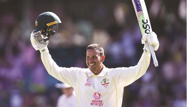 Australiau2019s Usman Khawaja celebrates reaching his century on day four of the fourth Ashes Test against England at the Sydney Cricket Ground (SCG) yesterday. (AFP)