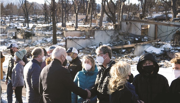 US President Biden and First Lady Jill Biden meet victims during their tour of a neighbourhood destroyed by the Marshall Fire in Louisville, Colorado.