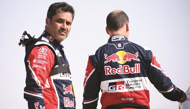 Qataru2019s Nasser al-Attiyah looks on during the Dakar Rally yesterday. (AFP)