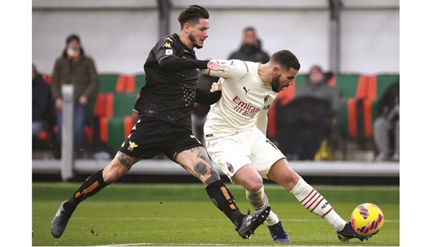 AC Milanu2019s Theo Hernandez (right) scores against Venezia during Serie A match in Venice. (AFP)