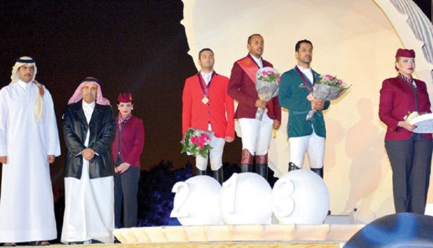Qataru2019s Bassem Hassan Mohammed (third from right) celebrates on the podium after winning Two Rounds, 145-160 cm event, yesterday.