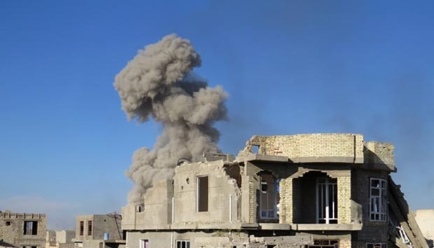 Smoke billowing in Ramadi's Hoz neighbourhood, about 110 kilometres west of Baghdad, during military operations conducted by Iraqi pro-government forces on Sunday against the Islamic State.