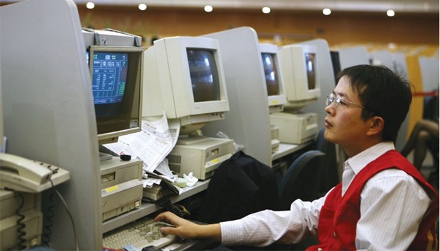 A trader works at the Shanghai Stock Exchange. The Shanghai Composite Index has rallied 13% in 2015, five times the average annual advance over the previous five years and crushing the MSCI All-Country World Index, which slumped 5%.