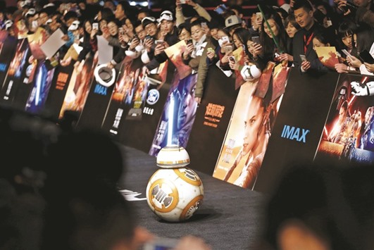 Droid character BB-8 arrives at the China premiere of Star Wars: The Force Awakens in Shanghai yesterday.
