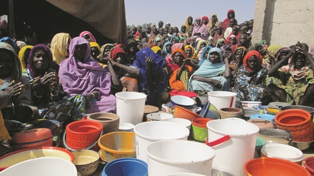 Women, who are among the internally displaced people camped at Dikwa, Borno State, gather during a visit by Borno State Governor Kashim Shettima, at the camp in Borno town of Nigeria yesterday.