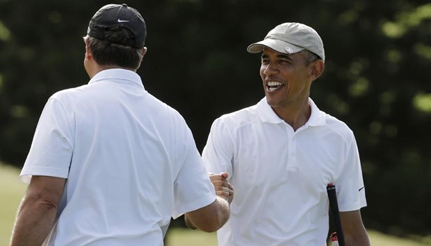 Barack Obama smiles as he finishes a round of golf with friends at the Mid-Pacific Country Club in Kailua, Hawaii.