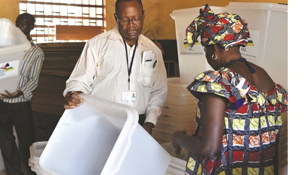 Election workers check vote materials at a polling station in Bangui on the eve of countryu2019s presidential and legislative elections yesterday.