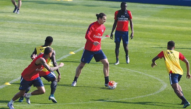 PSG striker Zlatan Ibrahimovic (C) during a training session yesterday.