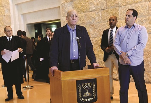 Former prime minister Ehud Olmert speaks to the media after a hearing at the Supreme Court in Jerusalem yesterday.
