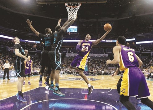LA Lakersu2019 Kobe Bryant (second from right) in action against Charlotte Hornets on Monday. (AFP)
