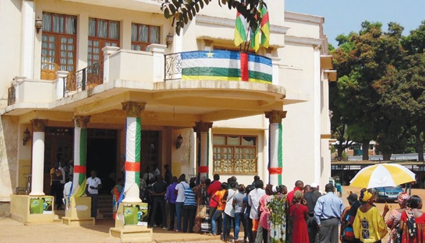 People queue to cast their votes at a polling station set up at the Hotel De Ville during the presidential election in Central African Republicu2019s capital Bangui.
