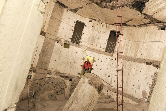 The cavernous interior of the leaning tower of Sande. The rope ladder is hanging vertically. This space is used to train mountain climbers.