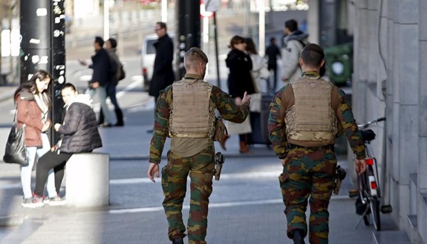 Belgian soldiers patrol in central Brussels on Thursday ahead of New Year's Eve.