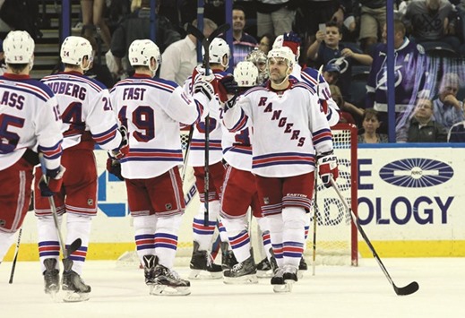 New York Rangers defenseman Dan Boyle (R) celebrates with teammates after beating Tampa Bay Lightning during the third period at Amalie Arena. PICTURE: USA TODAY Sports
