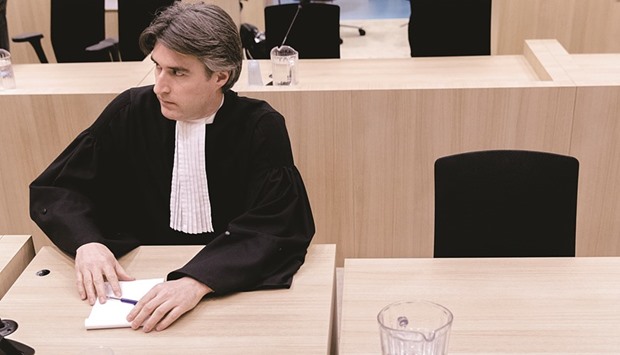 Wildersu2019 lawyer Maartenu2019t Sas listens to the verdict against his client at the courtroom in Schiphol. His clientu2019s seat is empty because Wilders did not attend the hearing.