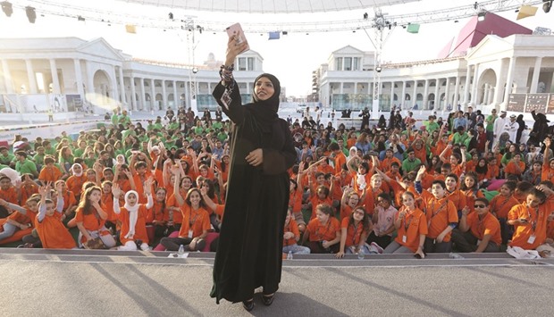 Fatma al-Remaihi takes a selfie with the Ajyal jurors yesterday.
