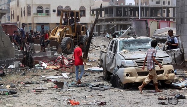 Yemenis inspect the site of a suicide car bombing in Aden. File picture