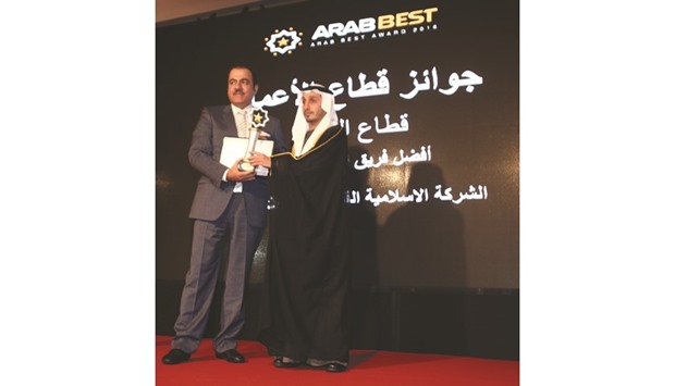 Al-AbdulGhani receives the honour during the award ceremony.