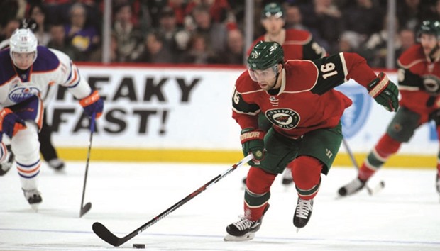 Minnesota Wild forward Jason Zucker carries the puck up ice during the third period against the Edmonton Oilers.